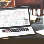 Online site plan drawing on laptop for building permit submission and residential property layout planning