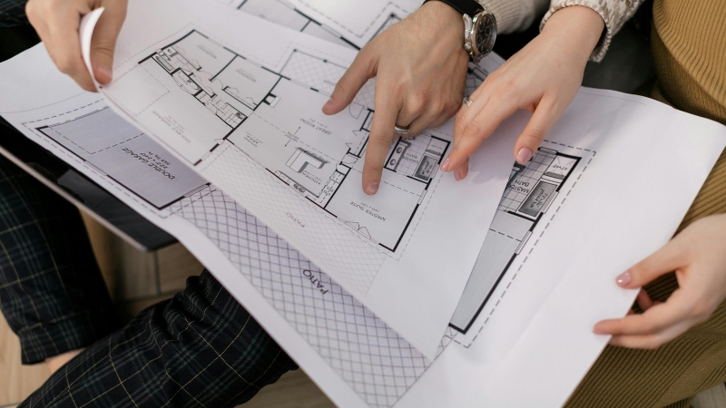 An architectural site plan blueprint displaying commercial property layouts, building footprints, and parking lots.