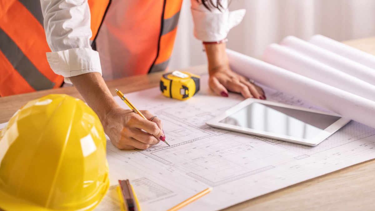 city plan red markups on architectural drawings showing permit corrections and review comments