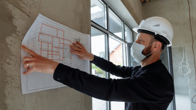 Multi-sheet engineering blueprints displaying existing conditions, topographic contours, and grading plans for a subdivision.