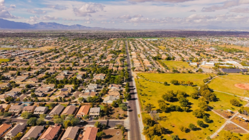An aerial view of a growing Arizona suburban community showcasing desert residential development and land planning.